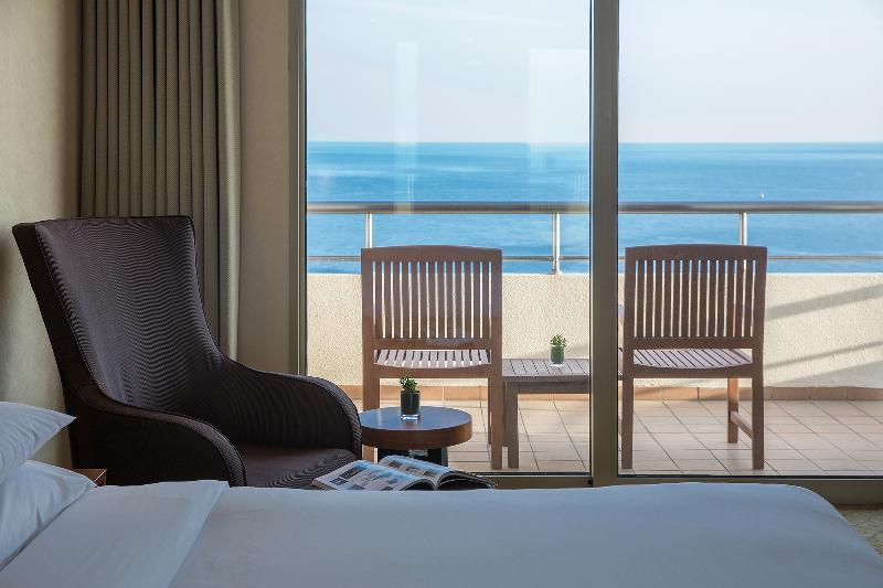 Parnas Hotel Jeju Seogwipo Exterior foto A room at the hotel